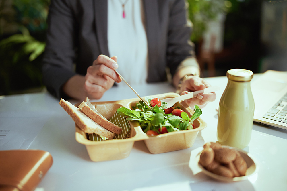 Employee enjoying healthy meal at work